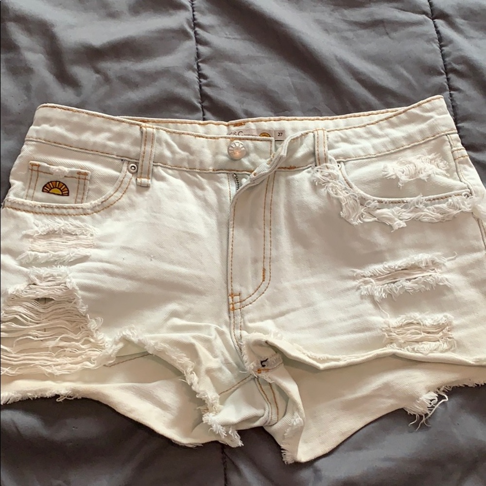 White distressed denim shorts